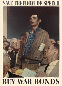 Man stands up proudly to speak; gray, brown, blue