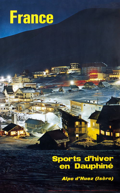 night time view of mountain and town; black, blue, yellow, white